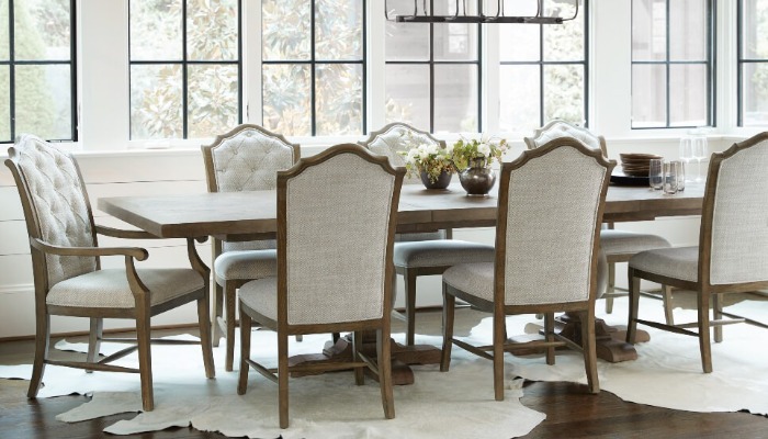 A furnished dining room with a table, chairs, and a rug bought in Temple, AZ